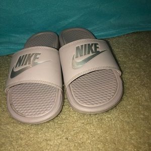 Rose colored Nike slides